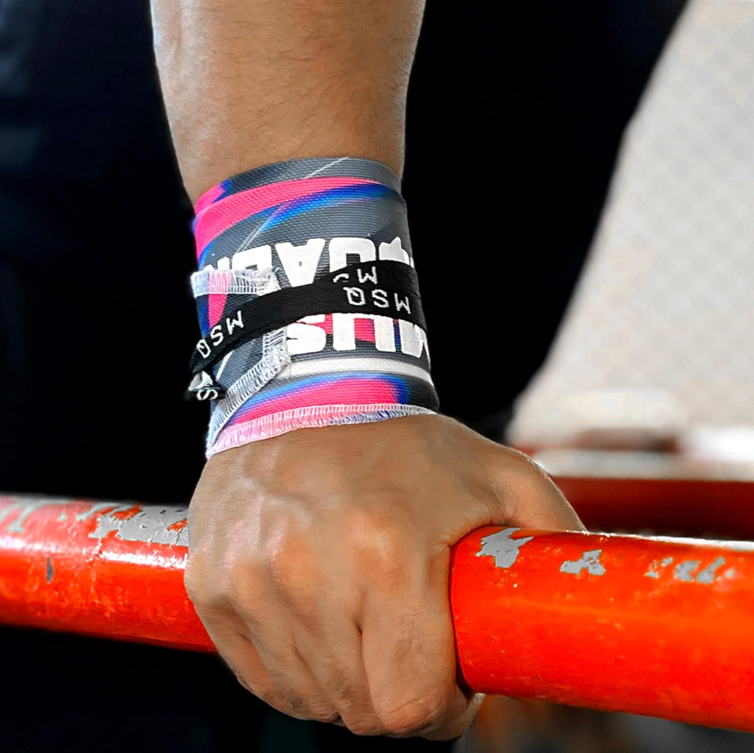 Close-up of a hand gripping a pull-up bar, wearing Gripzora Urban Streetwear calisthenics wrist wraps for enhanced stability and injury prevention.