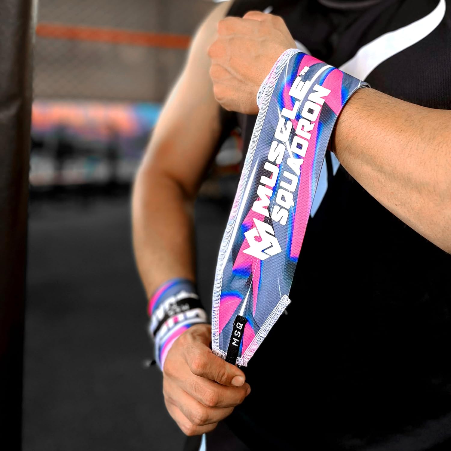 Close-up of a man's wrist, showing Gripzora's Urban Streetwear wrist wraps providing firm stability and support during a workout.