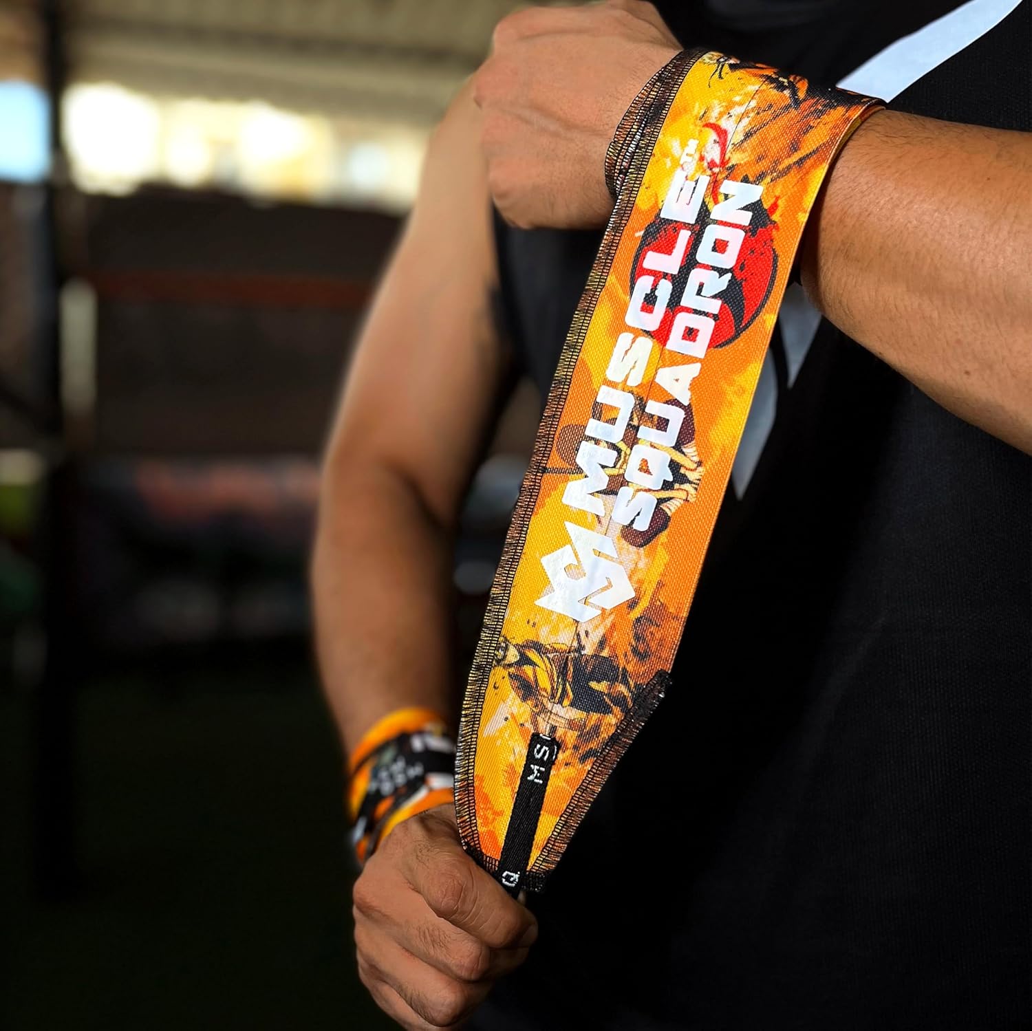 Close-up of a man's wrist, showing Gripzora's Power Weave wrist wraps providing firm stability and support during a workout.