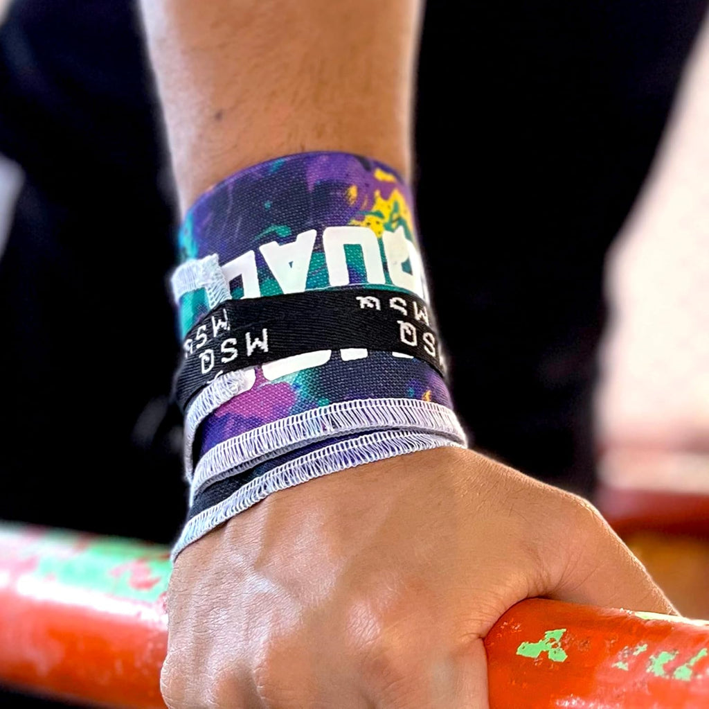 Close-up of a hand gripping a pull-up bar, wearing Gripzora Vandal Print calisthenics wrist wraps for enhanced stability and injury prevention.