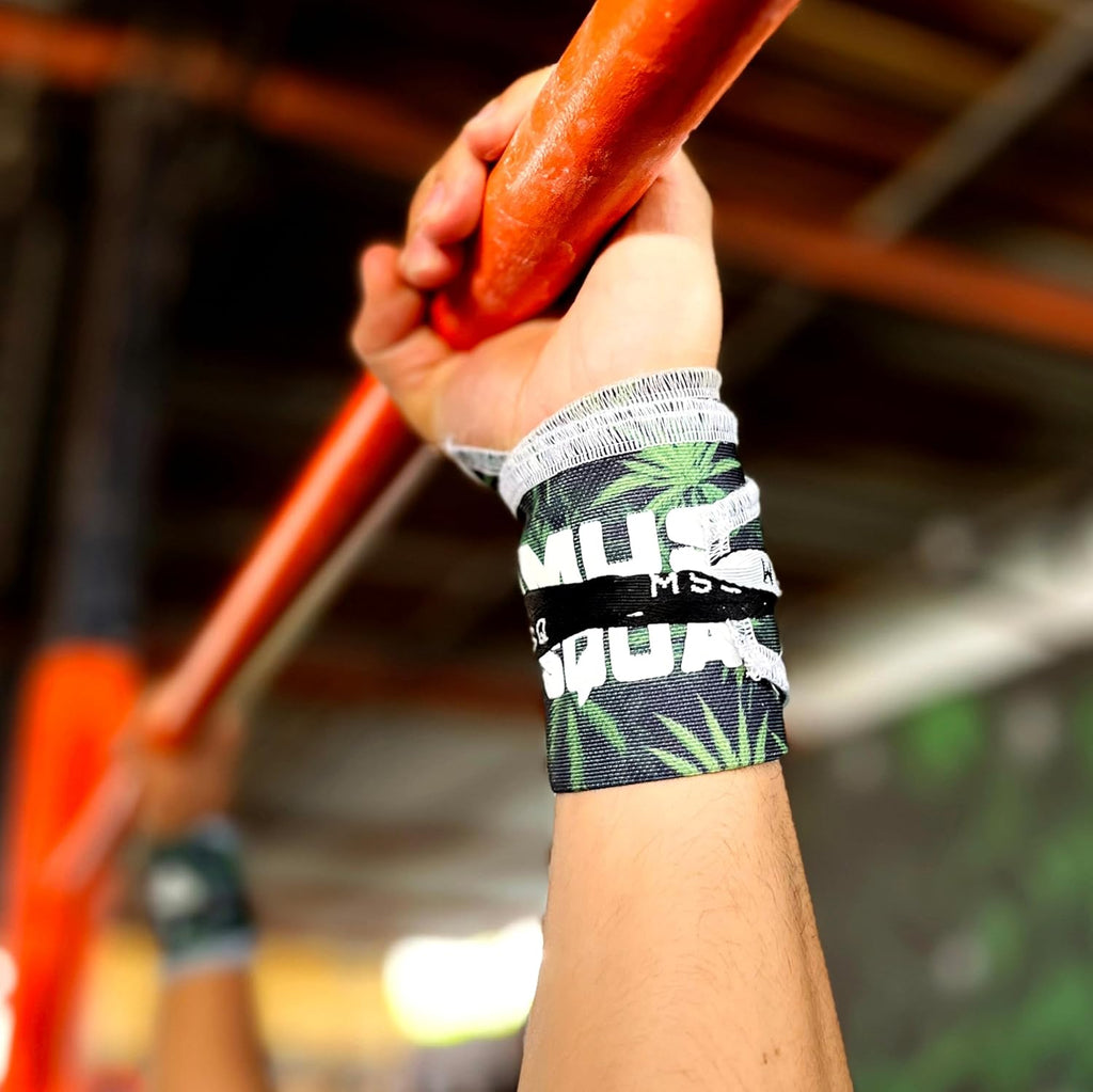 Close-up of a hand gripping a pull-up bar, wearing Gripzora Leafy Rush wrist wraps for enhanced stability during calisthenics and weightlifting.