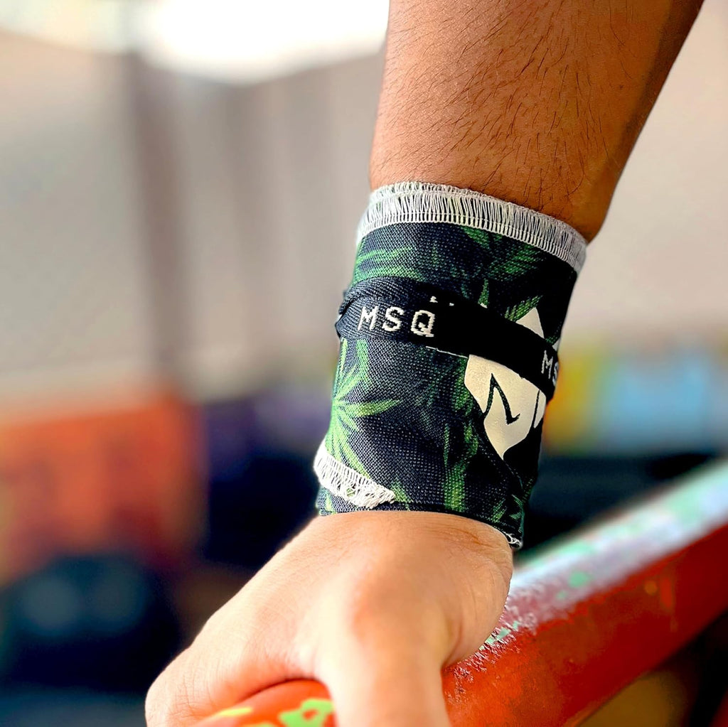 Close-up of a hand wearing Gripzora Leafy Rush wrist wraps, providing crucial stability and support during heavy lifts and calisthenics training.