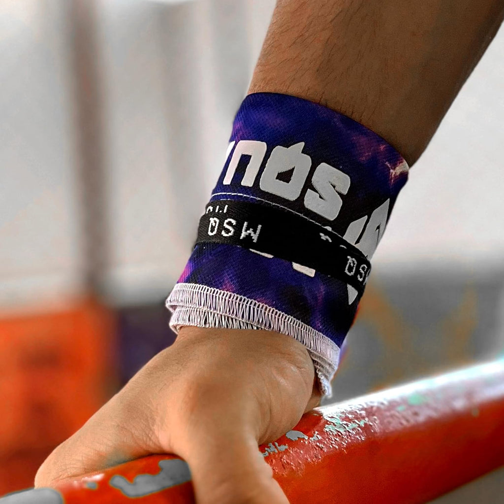 Close-up of a hand gripping a pull-up bar, wearing Gripzora Interstellar calisthenics wrist wraps for enhanced stability and injury prevention.