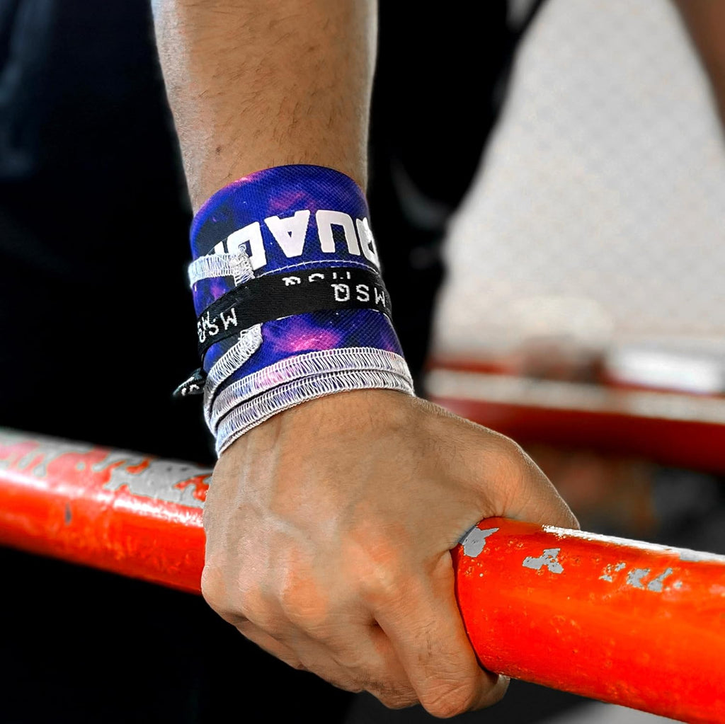 Close-up of a hand wearing Gripzora Interstellar wrist wraps, providing crucial stability and support during heavy lifts and calisthenics training.